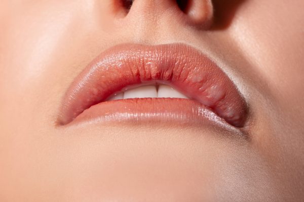 A close up of the lips and face of a woman